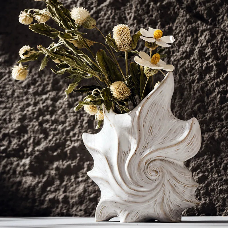 French art ceramic vase with coloured glaze in a European retro style, shown empty on a wooden surface.