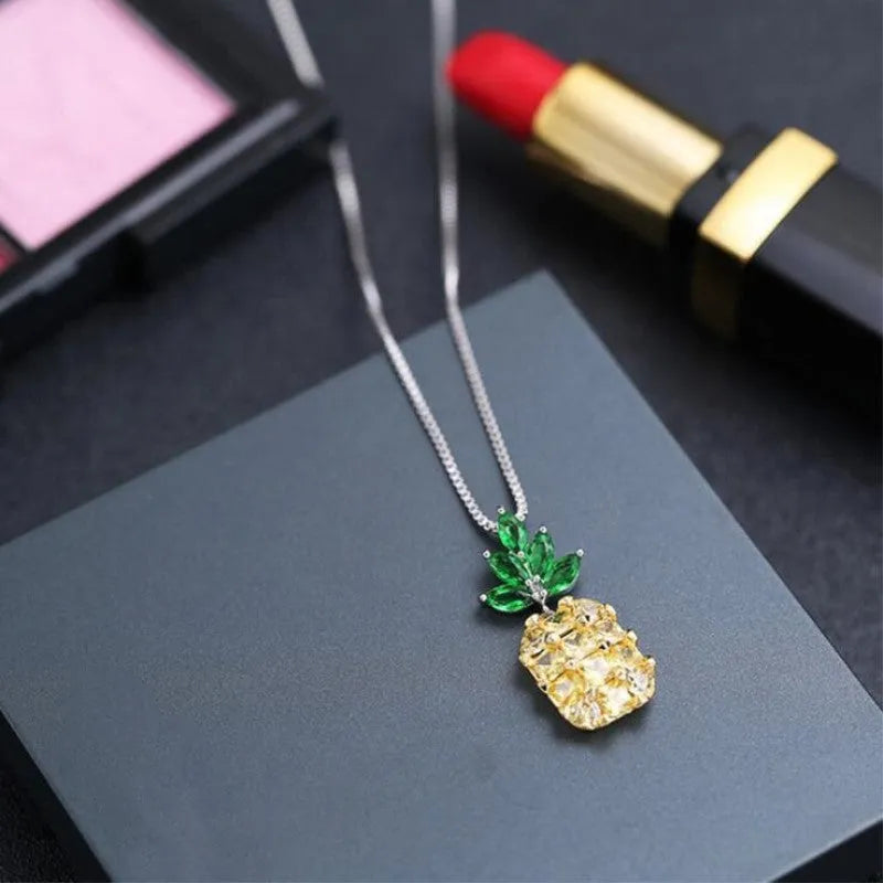 Geometric pineapple pendant necklace with silver and copper white gold plated finish on model