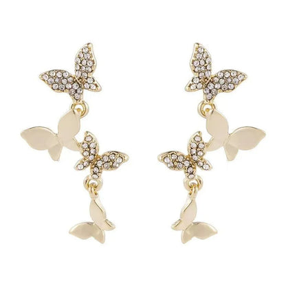 A pair of gold-coloured copper drop earrings with four detailed butterfly charms.