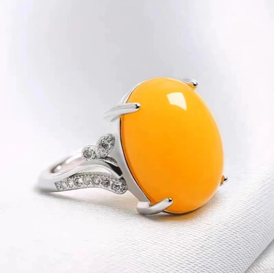 Adjustable alloy women's ring with geometric ethnic design in blue, green, red, yellow, or black.