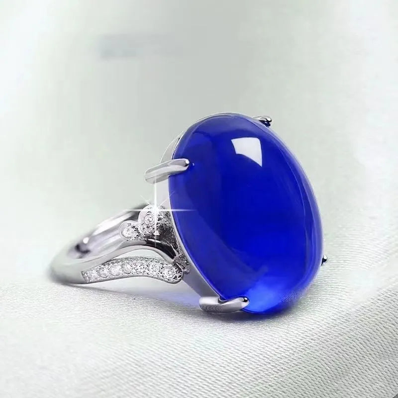 Adjustable alloy women's ring with geometric ethnic design in blue, green, red, yellow, or black.