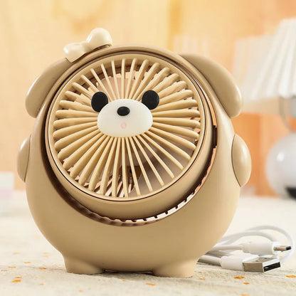 USB desktop fan with dog design showing three speed buttons and USB port, placed on a desk.