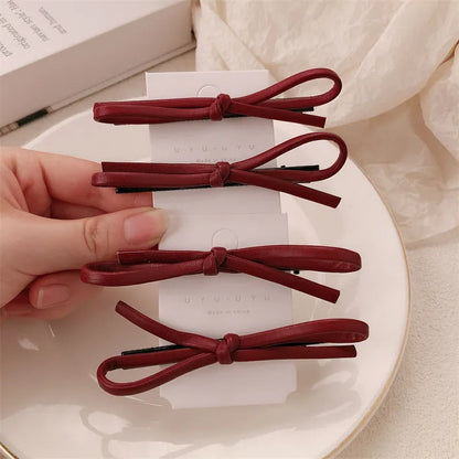 Wine red leather bow hair barrette with 2.5cm bow width and 5cm clip length