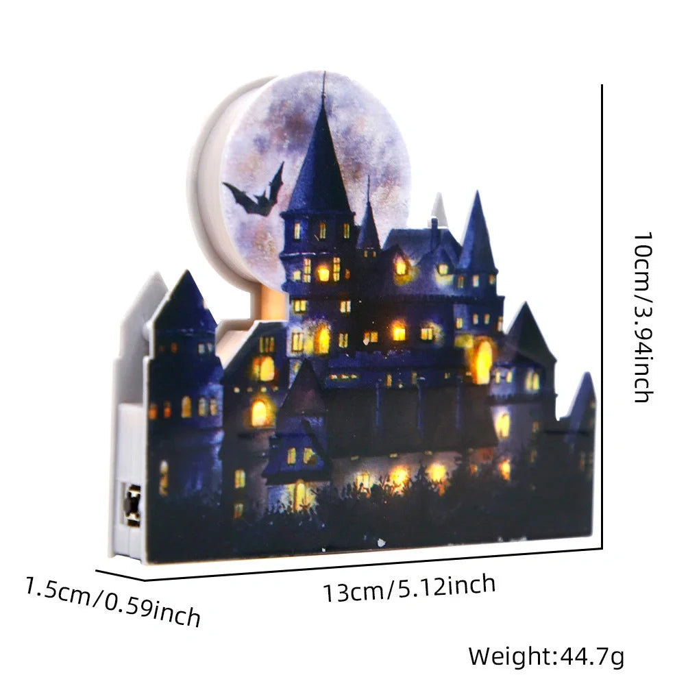LED illuminated castle ornament with turrets and textured surfaces on desktop
