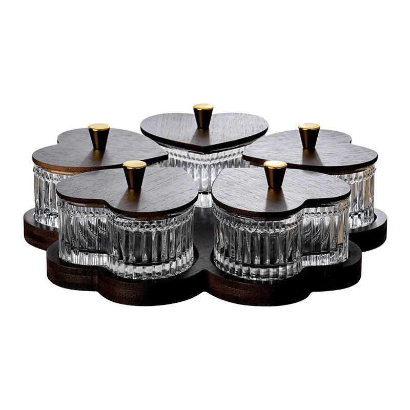 Glass dim sum fruit platter with coloured glaze and a transparent heart-shaped lid on a multi-grid tray.