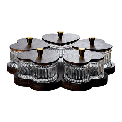 Glass dim sum fruit platter with coloured glaze and a transparent heart-shaped lid on a multi-grid tray.