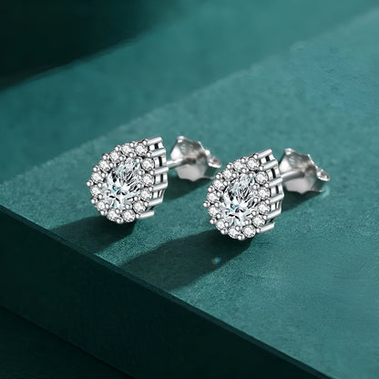 A pair of women's silver drop-shaped ear studs with a polished finish on a white background.