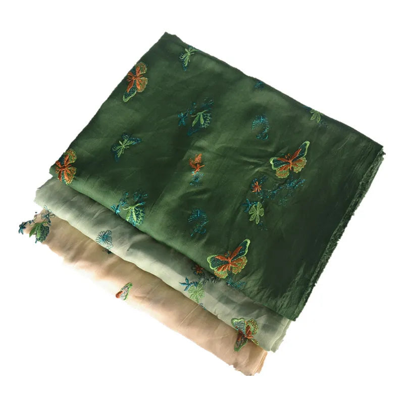 Pure ramie embroidery cloth hanfu fabric in beige, grass green, and dark green colours showing natural texture