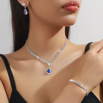 Rhinestone claw chain necklace and earrings set with water drop shaped pendants