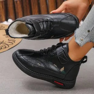Women's black velvet indoor shoes with non-slip rubber soles and hollow out detail.