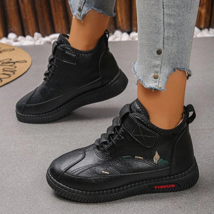 Women's black velvet indoor shoes with non-slip rubber soles and hollow out detail.