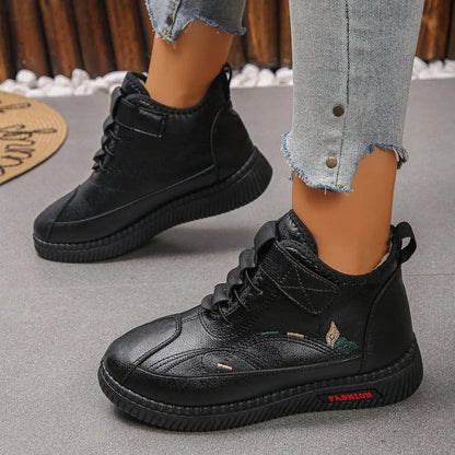 Women's black velvet indoor shoes with non-slip rubber soles and hollow out detail.