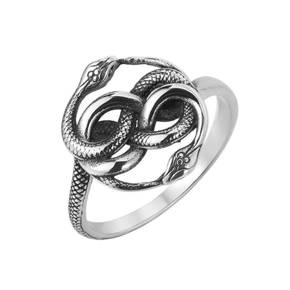 Titanium steel double snake ring in steel colour with retro design, shown on a finger.