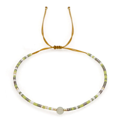 Handmade women's bracelet with colourful geometric glass and coloured glaze beads in Bohemian style.