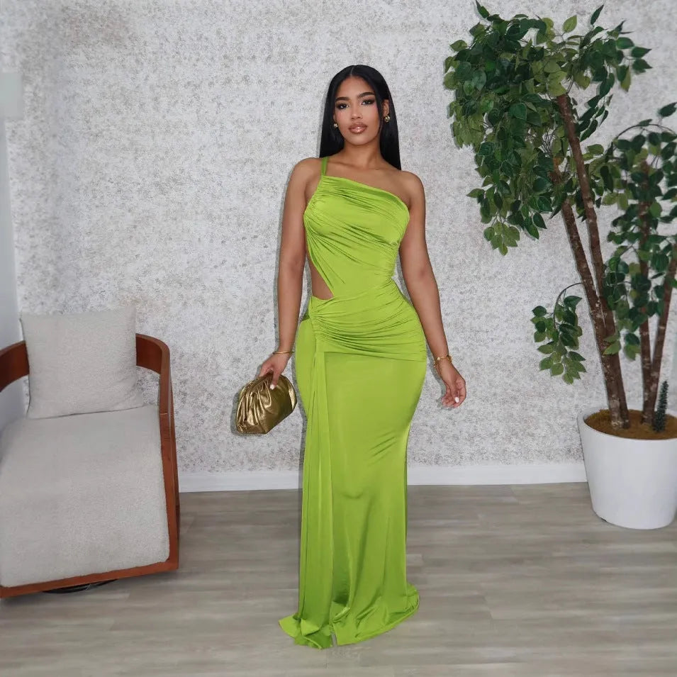 Women's long green one shoulder pleated dress with sleeveless design and hip skirt cut.