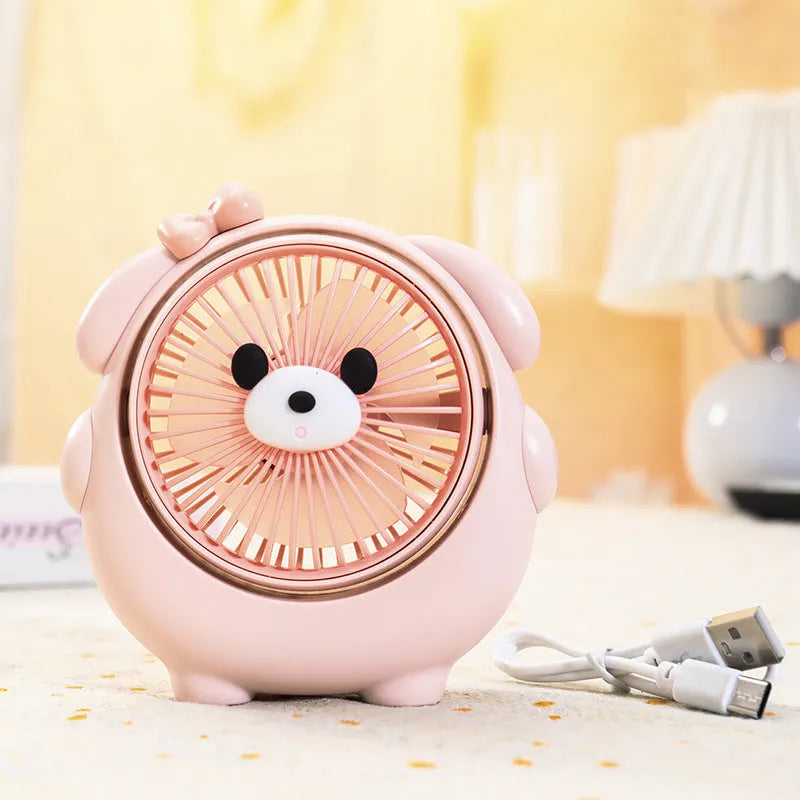 USB desktop fan with dog design showing three speed buttons and USB port, placed on a desk.