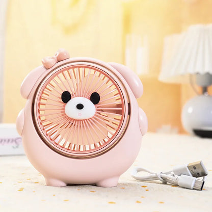 USB desktop fan with dog design showing three speed buttons and USB port, placed on a desk.