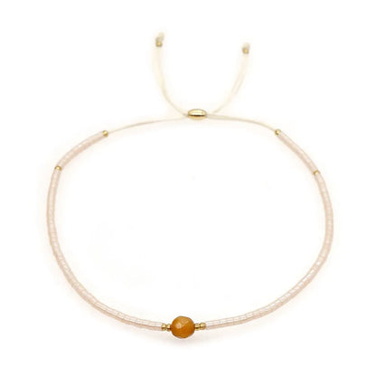Handmade women's bracelet with colourful geometric glass and coloured glaze beads in Bohemian style.