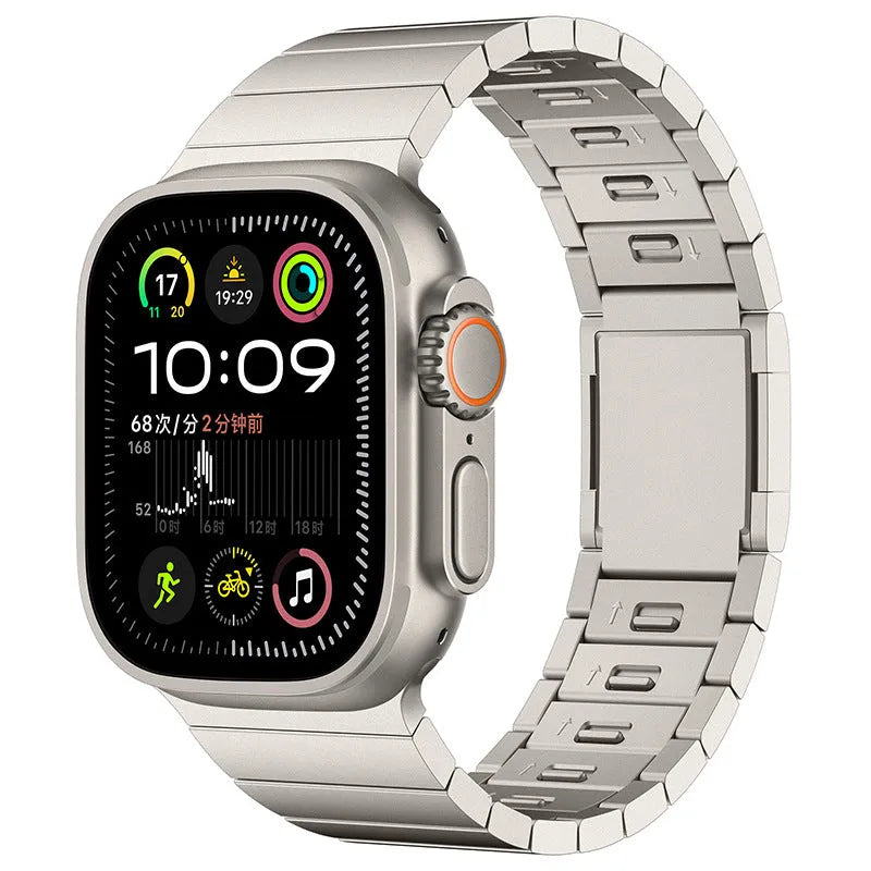 Silver stainless steel magnetic buckle strap attached to an Apple Watch on a wrist.