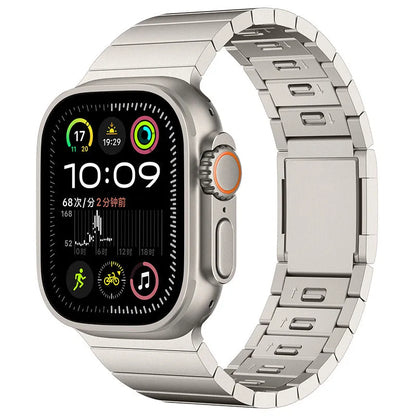 Silver stainless steel magnetic buckle strap attached to an Apple Watch on a wrist.