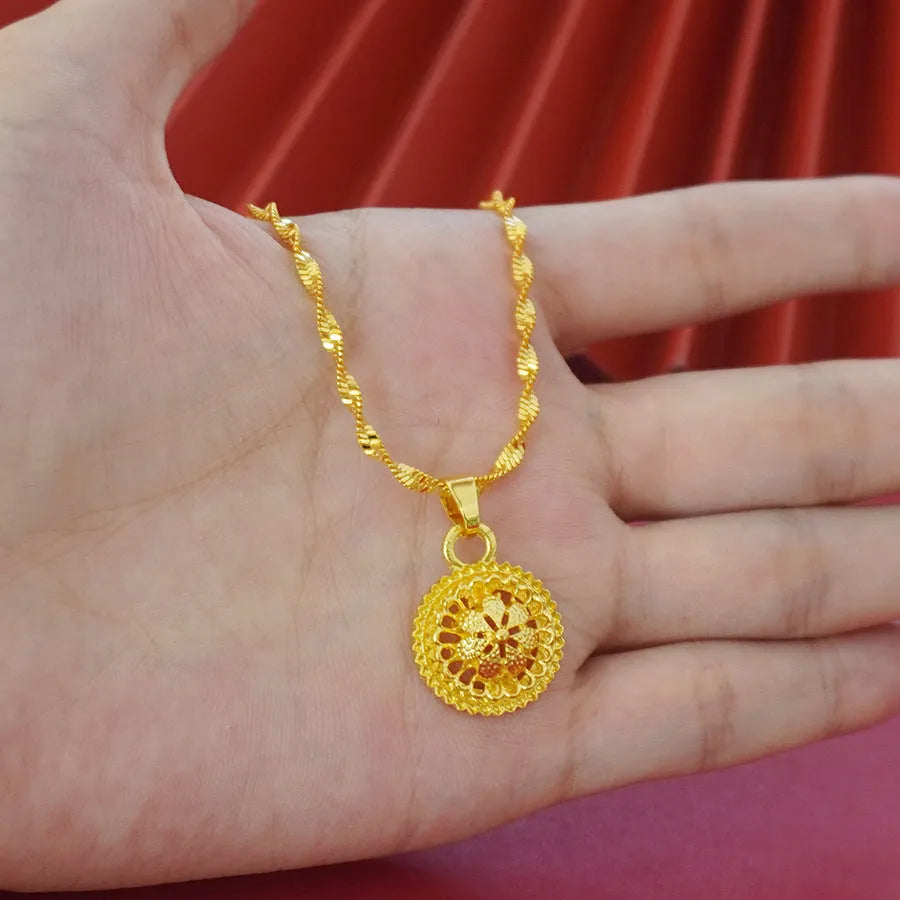 Gold-plated three-piece jewellery set with a three-layer flower design necklace, matching earrings, and ring on a white background.