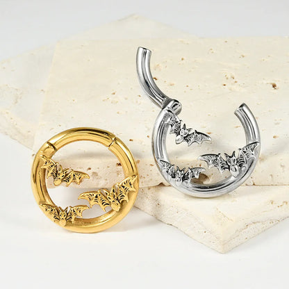 A pair of stainless steel fashion earrings featuring a totem pattern design in an electroplated colour.