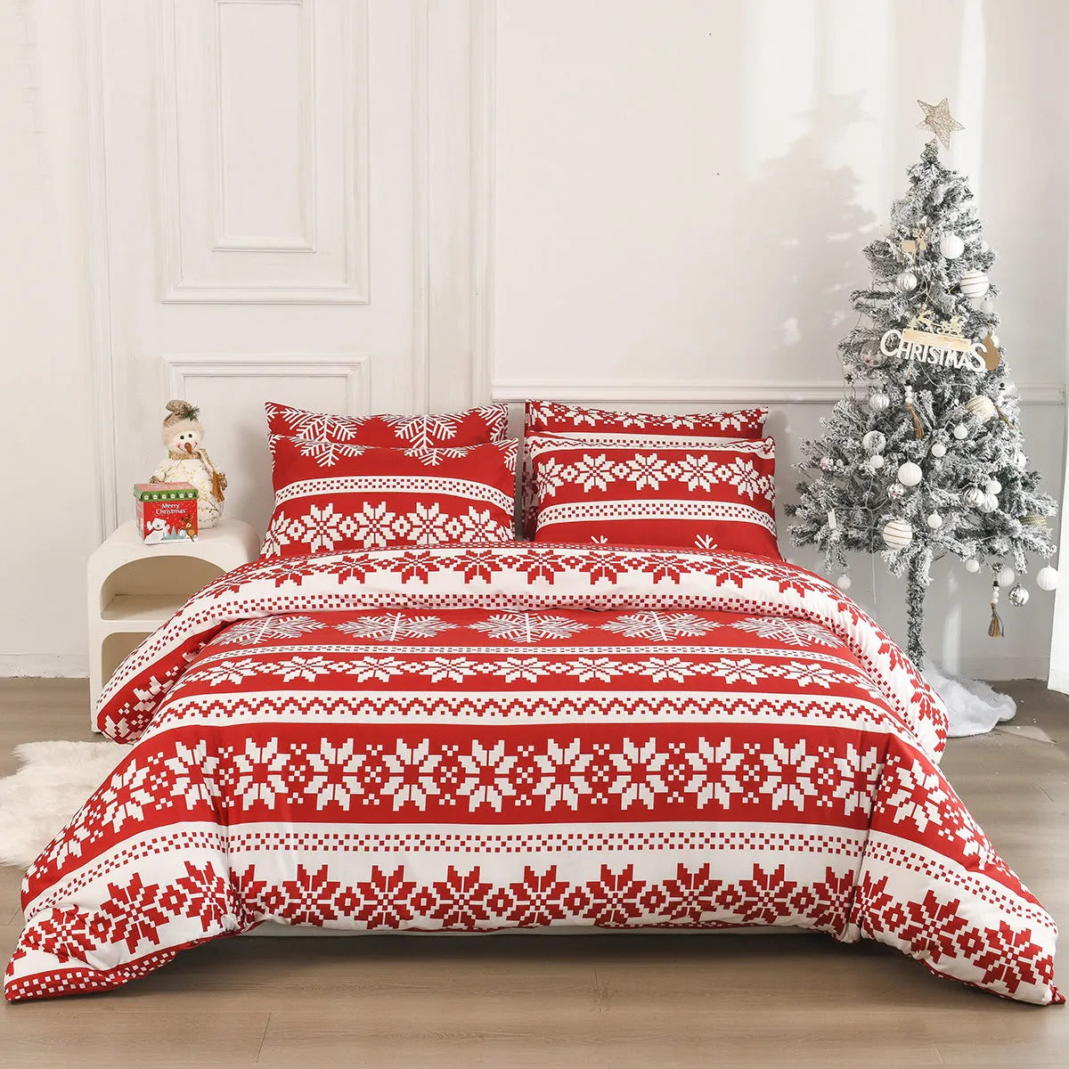 Red Winter Sleepers patterned three-piece bed set with quilt cover and pillowcases on a bed.