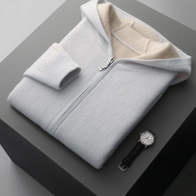 Man's dark blue zip-up cashmere cardigan with a half-high collar, shown on a hanger.