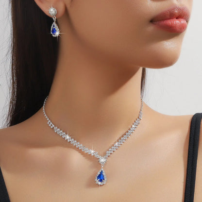 Rhinestone claw chain necklace and earrings set with water drop shaped pendants
