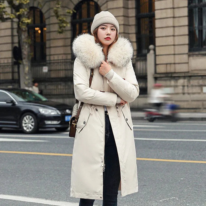 Long white women's fleece trench coat with down cotton padding on a hanger.