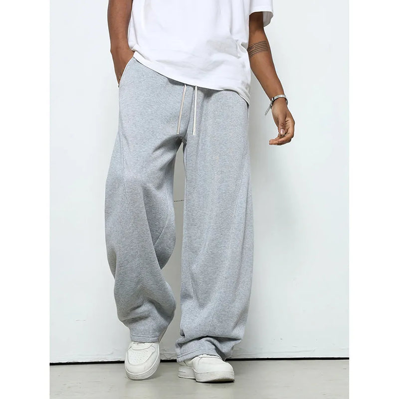 Men's casual trousers with polyester fabric and micro-elastic waist in solid colours including black, dark grey, and light grey for leisure wear with straight leg styling and mid-rise fit