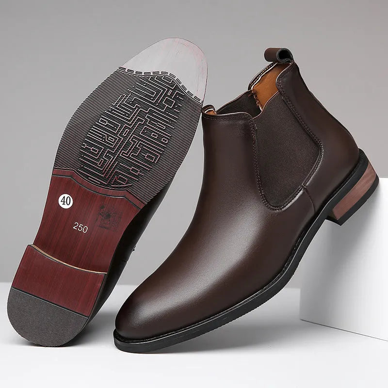 Men's black pointed toe Chelsea boots with a decorative sewing thread detail on the artificial PU upper.