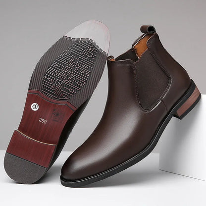 Men's black pointed toe Chelsea boots with a decorative sewing thread detail on the artificial PU upper.