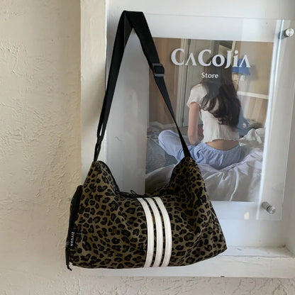Leopard print sports style shoulder messenger bag with visible stitching and cross-body strap