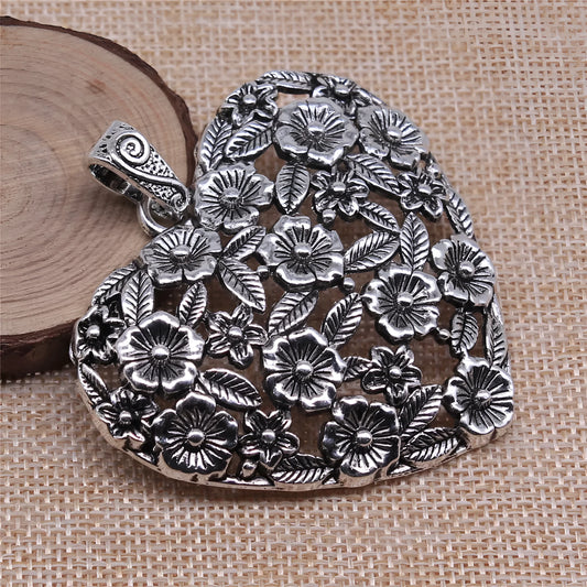 Ancient silver hollow flower love alloy pendant measuring 67mm by 58mm