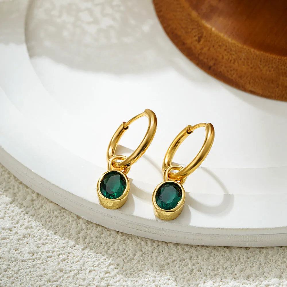 Women's copper oval earrings in six colour options showing elliptical 1.5cm retro design