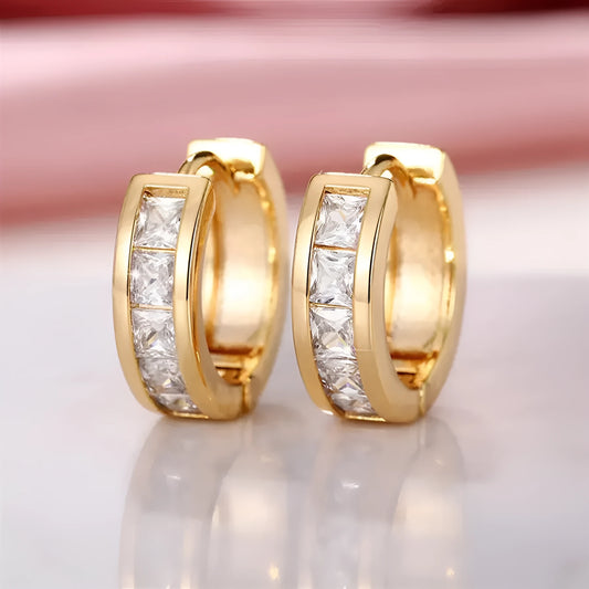 Geometric quadrilateral earrings in gold or silver plating, showing structured design and smooth surface finish