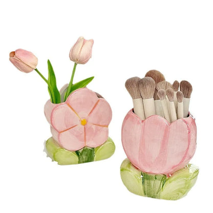Ceramic floral pen holder showing blue flowers pattern, measuring 11.8cm wide by 10cm high