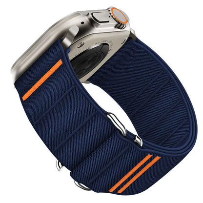 Elastic nylon Apple Watch band in Army Green with stainless steel buckle, shown on a wrist.