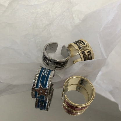 Geometric drop oil women's ring with adjustable band in distressed electroplated finish.