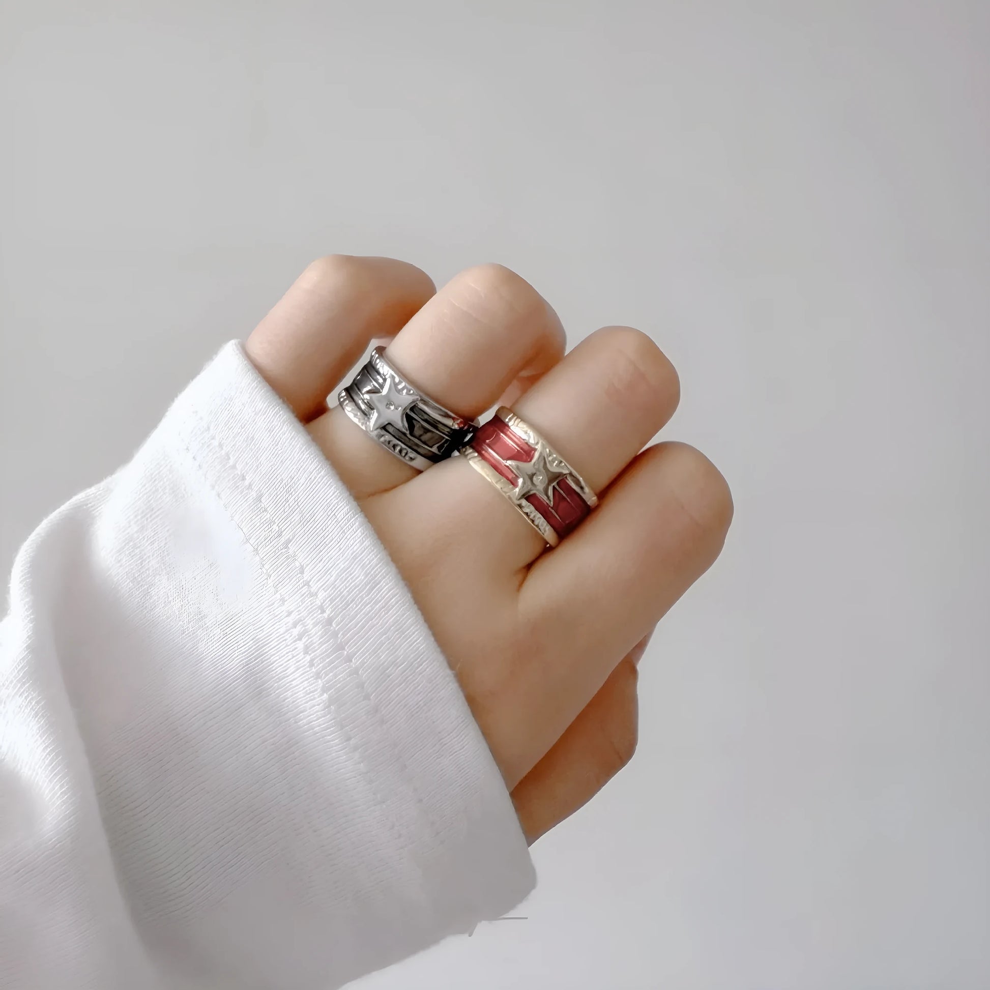 Geometric drop oil women's ring with adjustable band in distressed electroplated finish.