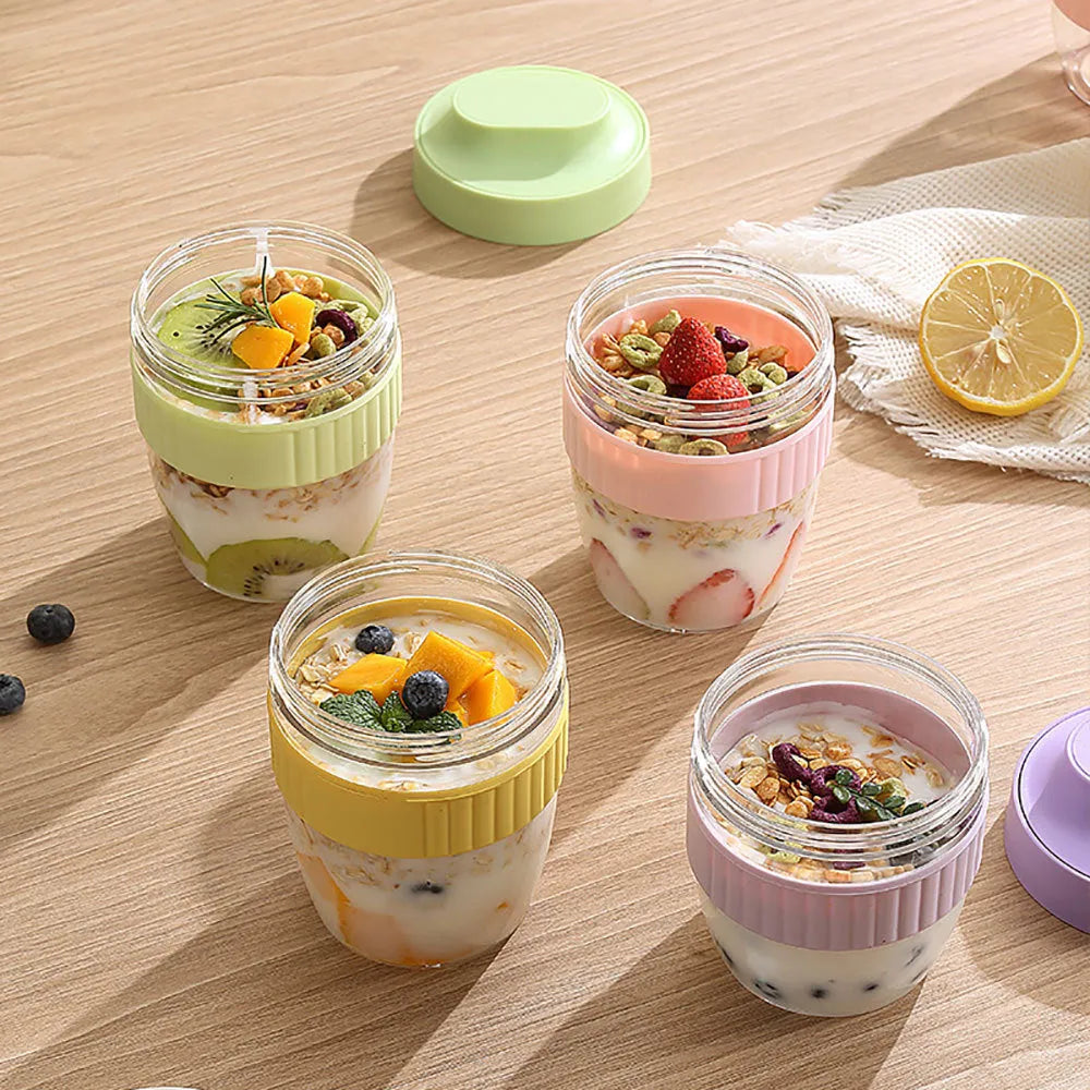 Green PP plastic salad cup with attached lid and spoon on a white background.