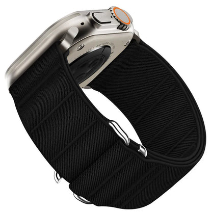 Elastic nylon Apple Watch band in Army Green with stainless steel buckle, shown on a wrist.