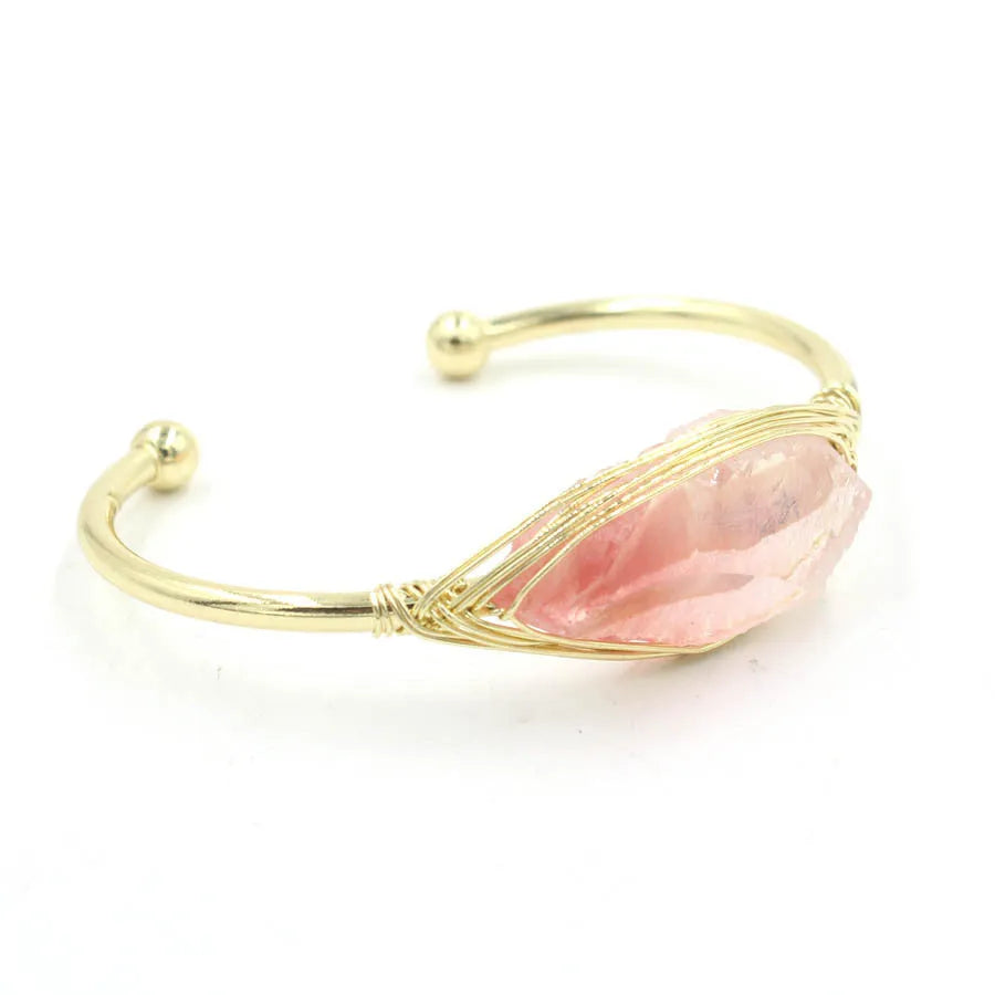 Natural raw gemstone bracelet with 8mm rough crystal beads in ethnic style, shown on wrist.