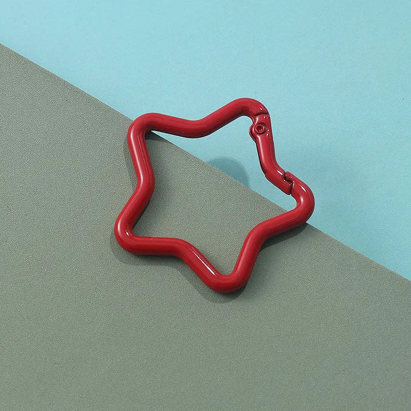 Zinc alloy five-pointed star keychain in various macaron colours.