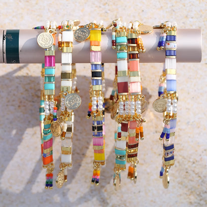 Women's handcrafted bracelet with imitation pearl and coloured glass beads in one of six colour styles.
