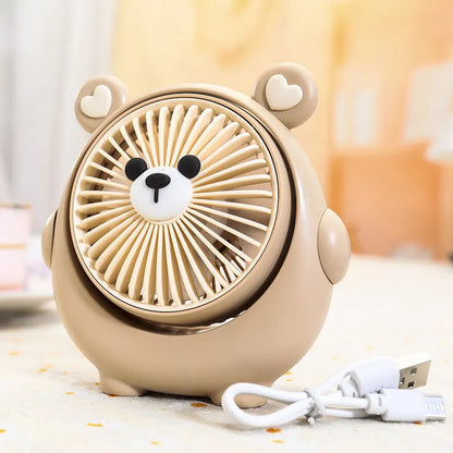 USB desktop fan with dog design showing three speed buttons and USB port, placed on a desk.