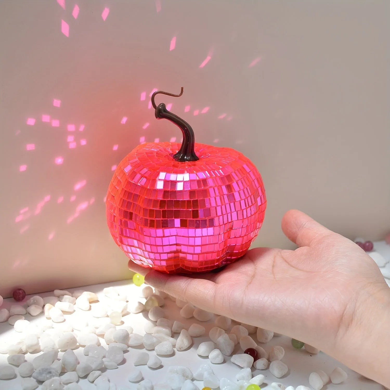 A Chinese-style embroidered glass pumpkin Halloween decoration in various sizes.