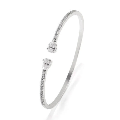 Close-up of a multi-zircon inlay fashion bracelet in copper, shown in blue and white colour options.