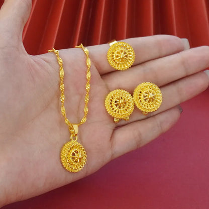 Gold-plated three-piece jewellery set with a three-layer flower design necklace, matching earrings, and ring on a white background.